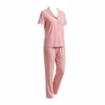 Ladies pyjama set in soft pink cotton single jersey, three-quarter angle view showing the notched camp collar, button-front placket, chest patch pocket, short sleeves and full-length pants