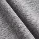 Close-up of the grey marl cotton single jersey of the men's briefs, showing the fine knit loops and heathered yarn texture