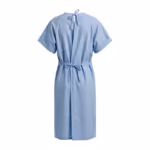 Light blue tie-back patient gown in poly-cotton, full back view with overlapping open-back panels fastened by cloth tie bows at the neck and at the waist, short sleeves