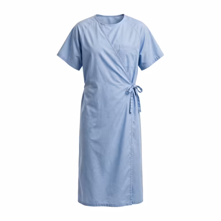Light blue wrap-front patient gown in poly-cotton, full front view with crossover front, cloth tie bow at the side waist, short sleeves, round neckline and one chest pocket