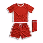 Complete soccer team kit laid flat as a set: red short-sleeve jersey in polyester eyelet mesh with white ribbed crew collar, white sleeve cuffs and white side panels, matching red shorts with elastic drawcord waist, white side stripes and white hem binding, and a folded pair of red ribbed knee socks with two white stripes, plain blank with no logos, names or numbers