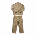 Work clothes set in khaki cotton twill, back view with the long-sleeve work shirt's plain yoke back laid above the matching flat-front work pants with belt loops and two back welt pockets as one outfit