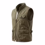 Work vest in olive cotton twill, three-quarter angle showing the bound armhole, chest pocket with buttoned flap, lower patch pocket and side tab buckle